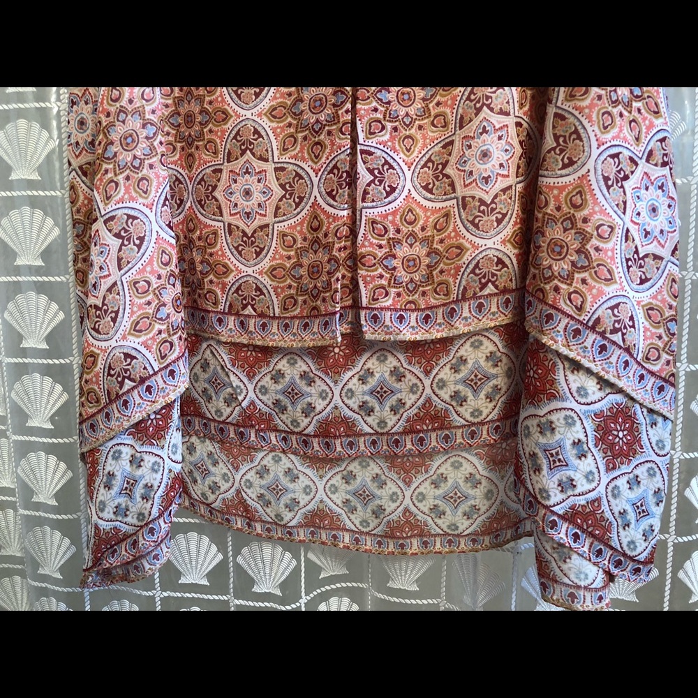 NWT Sleeveless blouse. Lined. Asymmetrical bottom.